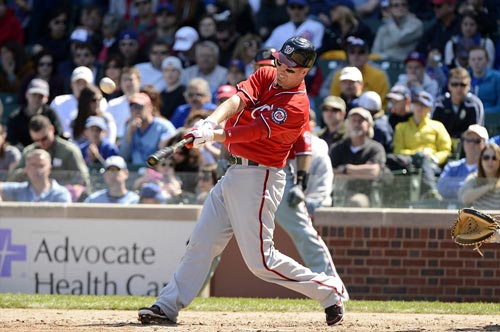 Adam LaRoche drives a ball that was caught by Chicago Cubs left fielder Alfonso Soriano