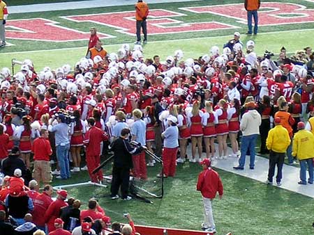 Huskers win and sing in the southeast corner of Tom Osborne Field.