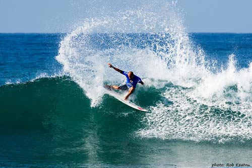 Kelly Slater surfing in the Boost Mobile.