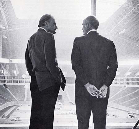 Billy Graham and Tom Landry overlook the almost-done Texas Stadium in 1970.
