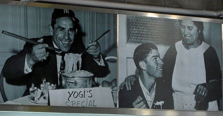 Yankee Hall of Famers Yogi Berra and Joe Dimaggio in the yankee Stadium food court.